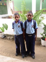 2 children in a school uniform in Colombia